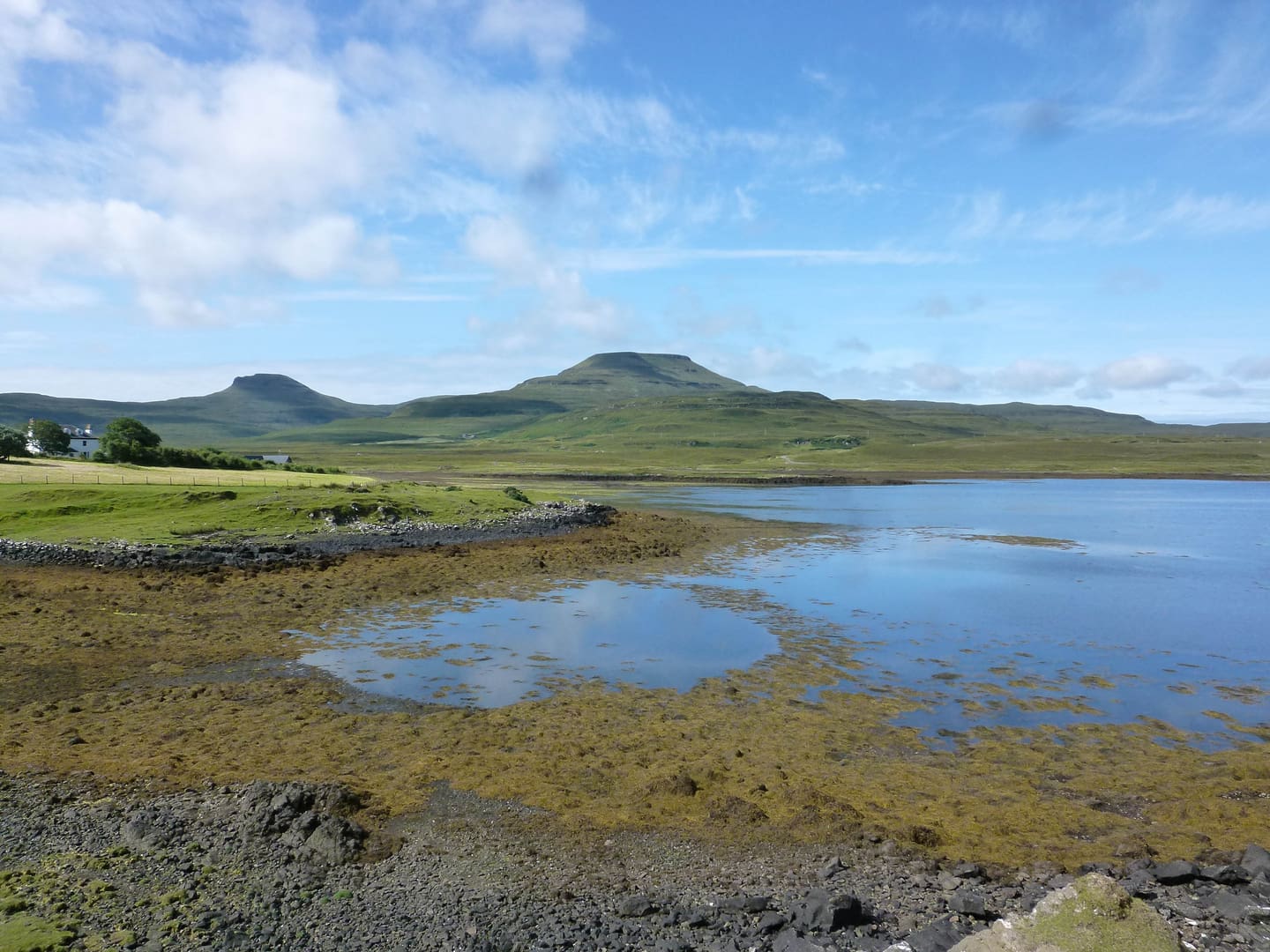 A body of water with mountains in the background.